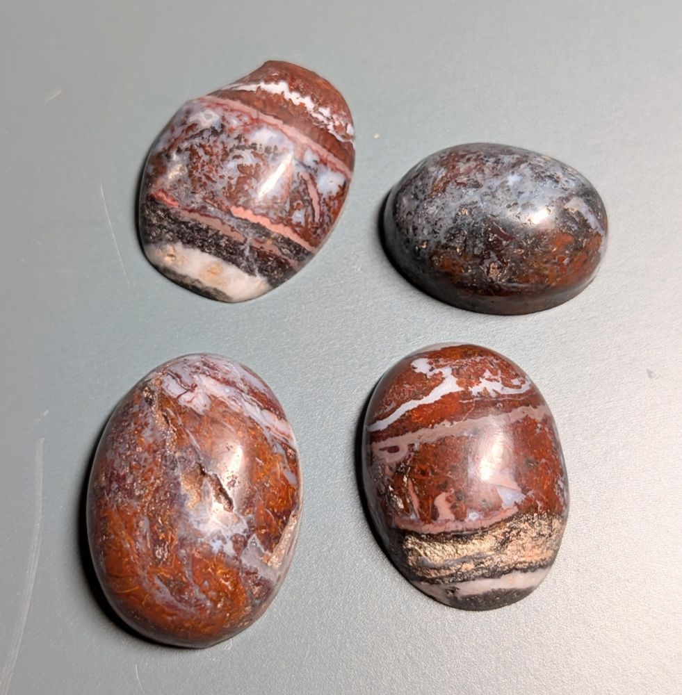 Four jasper cabochons. 