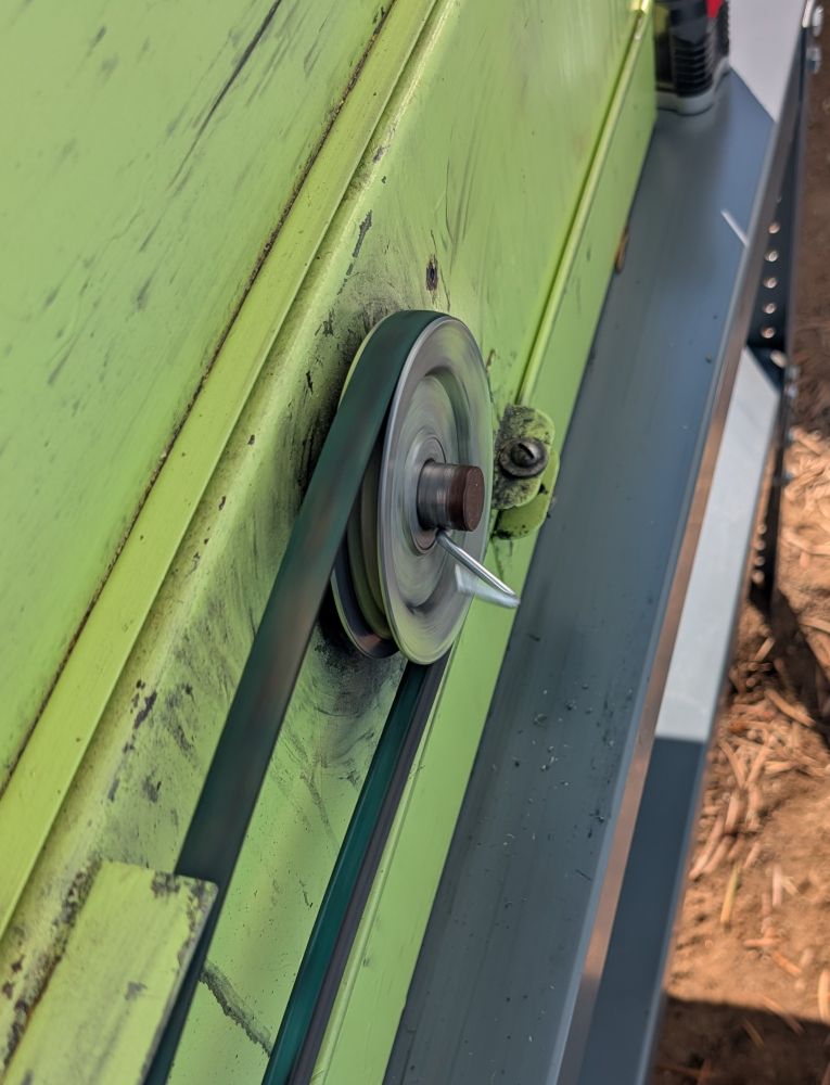 The wheel thingy part of a saw with a hook from my pegboard jammed into it, which earned me 25 redneck points. 