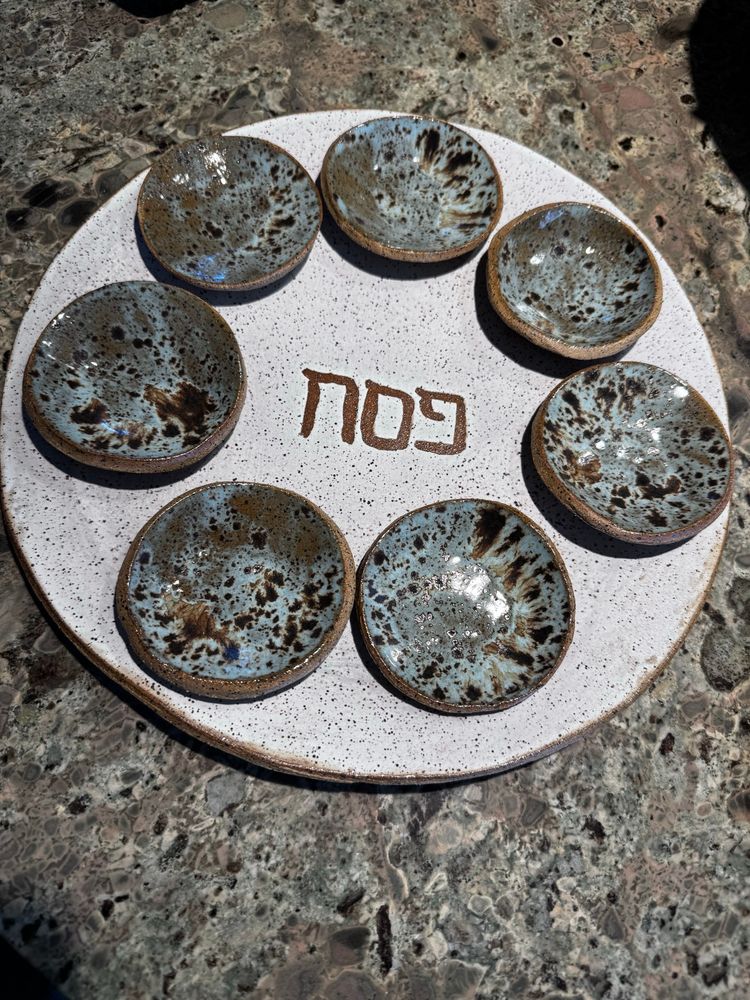 White seder plate with blue dishes