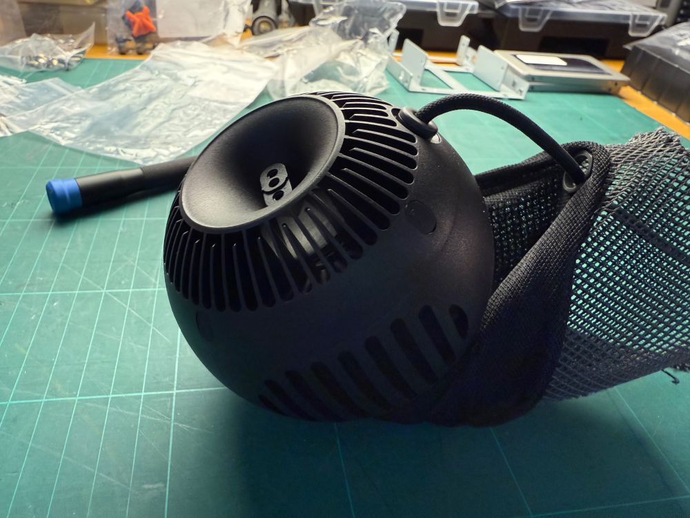 HomePod mini, disassembled, looks a bit like the child of a thermal detonator from Star Wars and the deathstar