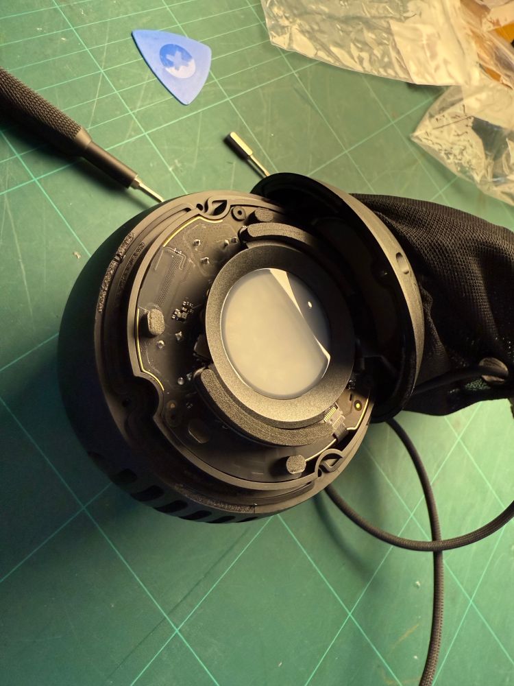 HomePod mini, disassembled, looks a bit like the child of a thermal detonator from Star Wars and the deathstar