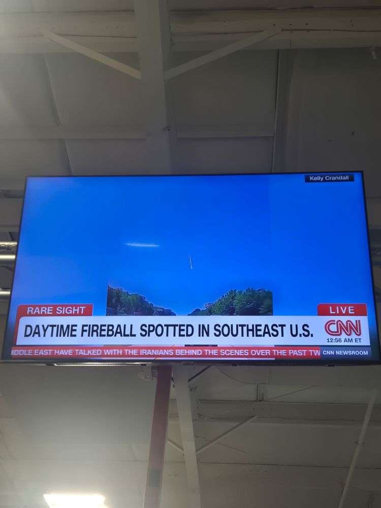 Picture of a flat-screen showing CNN. The headline reads: Daytime Fireball spotted in southeast US