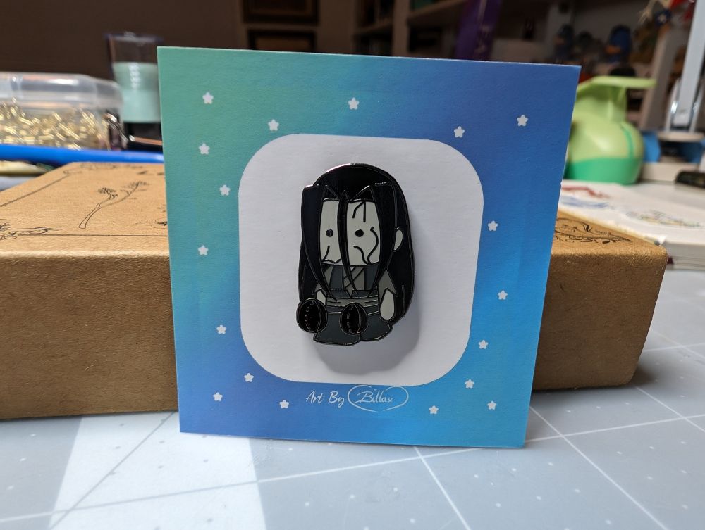 photo of a tiny enamel pin, featuring the Ghost General 鬼将军 Wen Ning 温宁 from Billacookie etsy shop