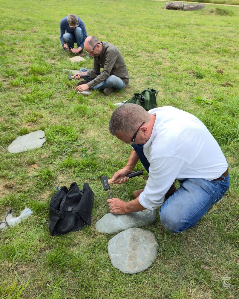 Tuatha Members having a go at stone carving