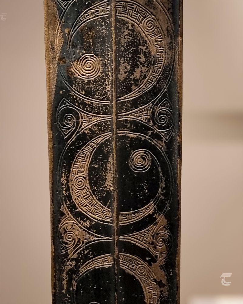 A close up of the intricate decoration on one of the scabbard plates