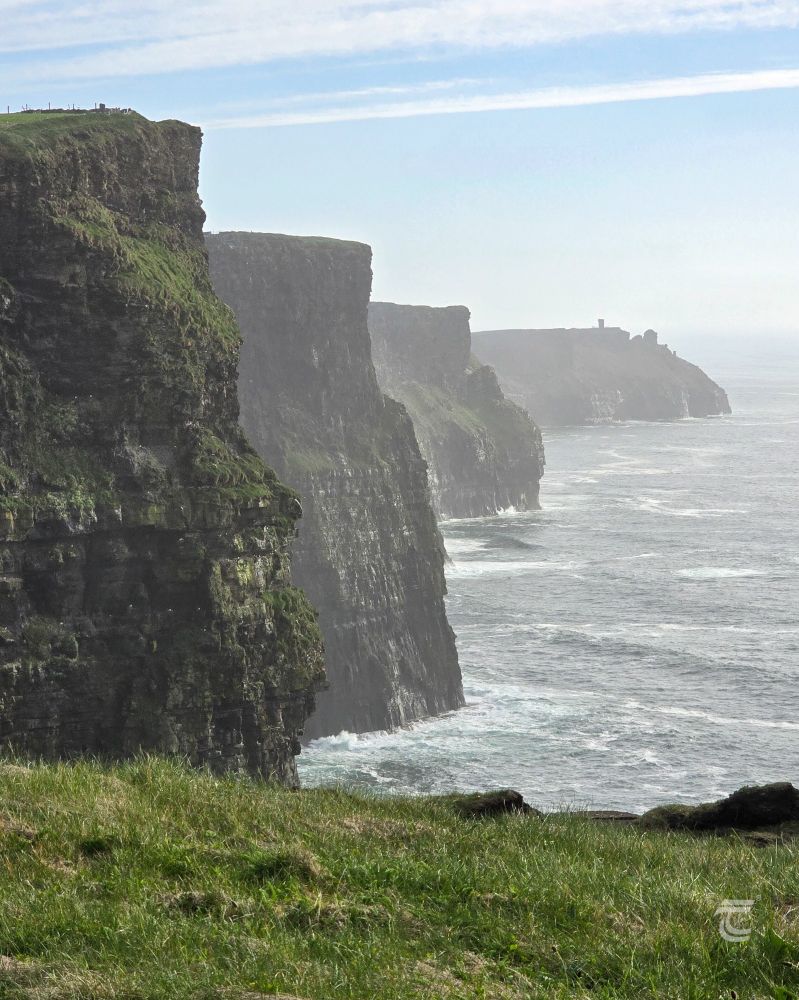 The Cliffs of Moher lit by a gentle sun