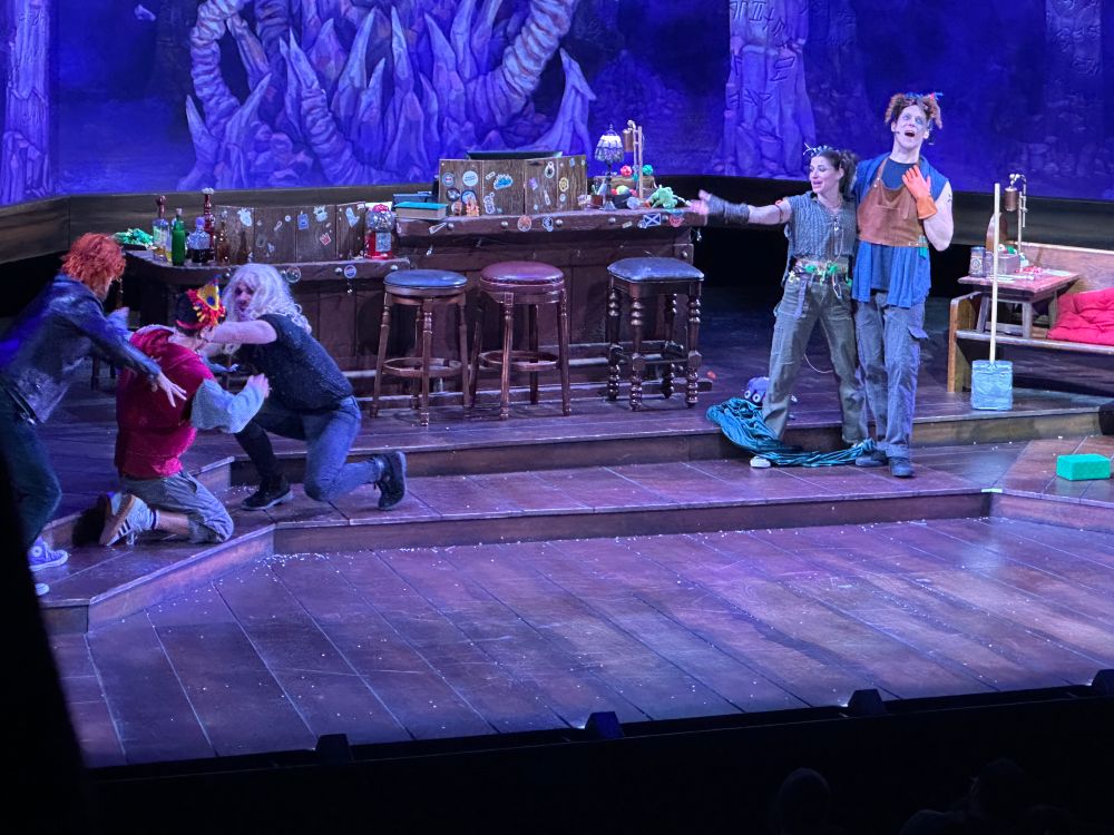 Neil newborn and twenty sided tavern cast being silly in costume and wigs on stage 