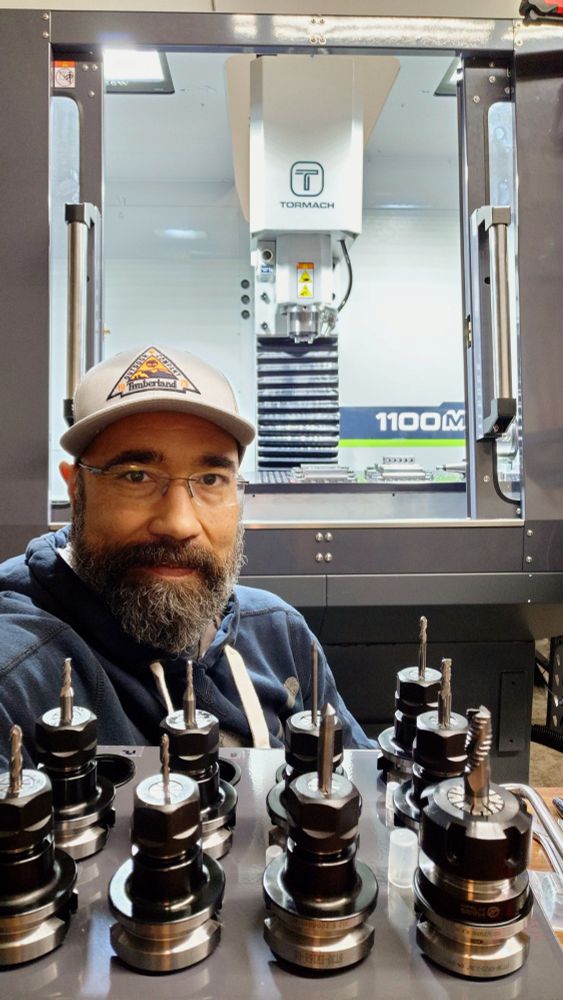 Terrance with tooling ready to make parts on the Tormach CNC Mill. 