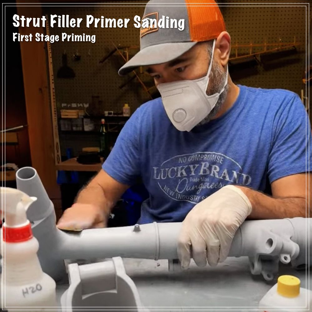 Terrance sanding the primer coat on the 787 main landing gear strut. 