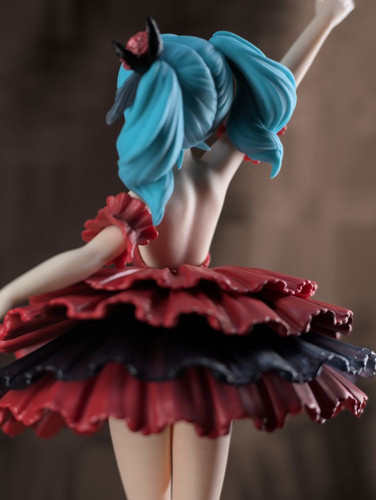 Medium shot straight on at waist level shot from the rear of the figure focusing on the figure's back modeling.