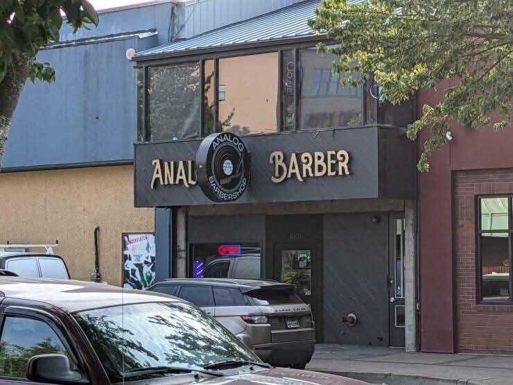 Sign out in front of a shop that reads, 