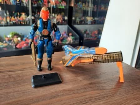 cobra commander figure with a ground tripod launcher based plane made of plastic