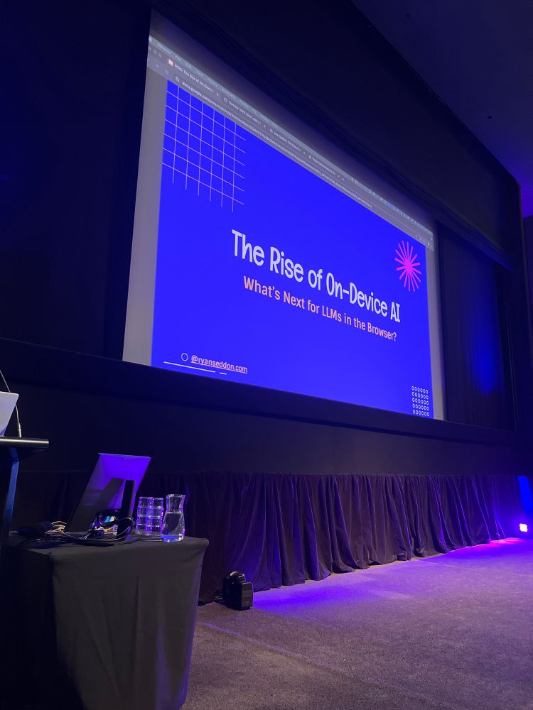 Photo of projector display of my talk the rise of on-device AI happening at web directions code 2025