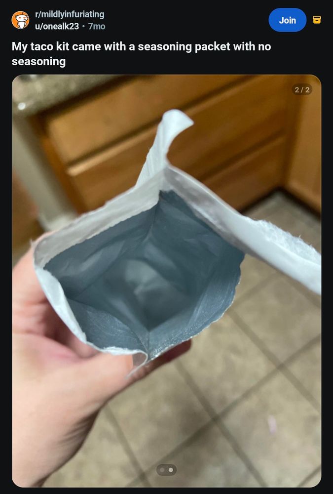 reddit post captioned "my taco kit came with no seasoning". a picture of a seasoning packet which has been opened, there is no seasoning inside