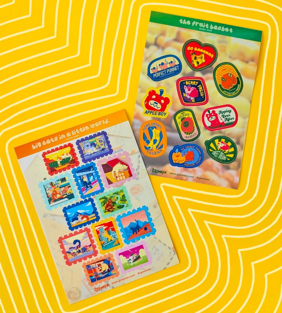 Photo of Gremren's new sticker sheet designs on a yellow background, with cream lines outlining them.