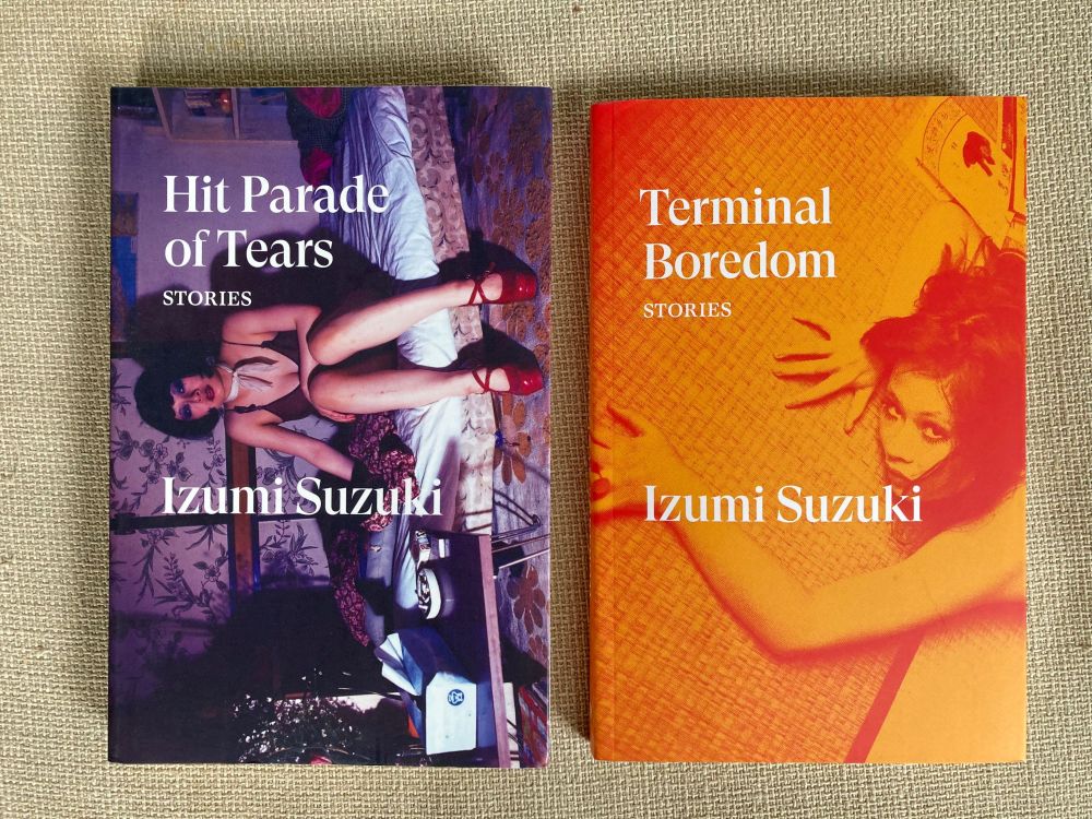 Suzuki’s Hit Parade of Tears and Terminal Boredom. Cover on left shows author sitting on a mattress. On right is the author laying on the ground. 