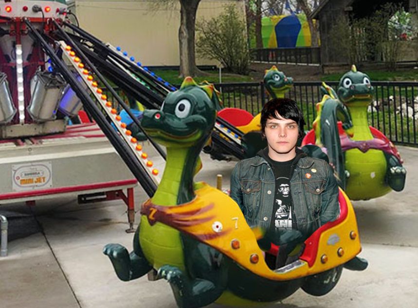 Gerard Way on a theme park ride. its a dragon themed ride. 
