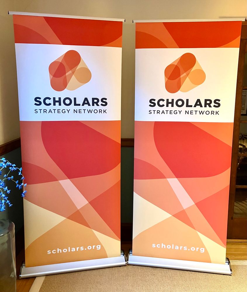 Two Scholars Strategy Network standing banners