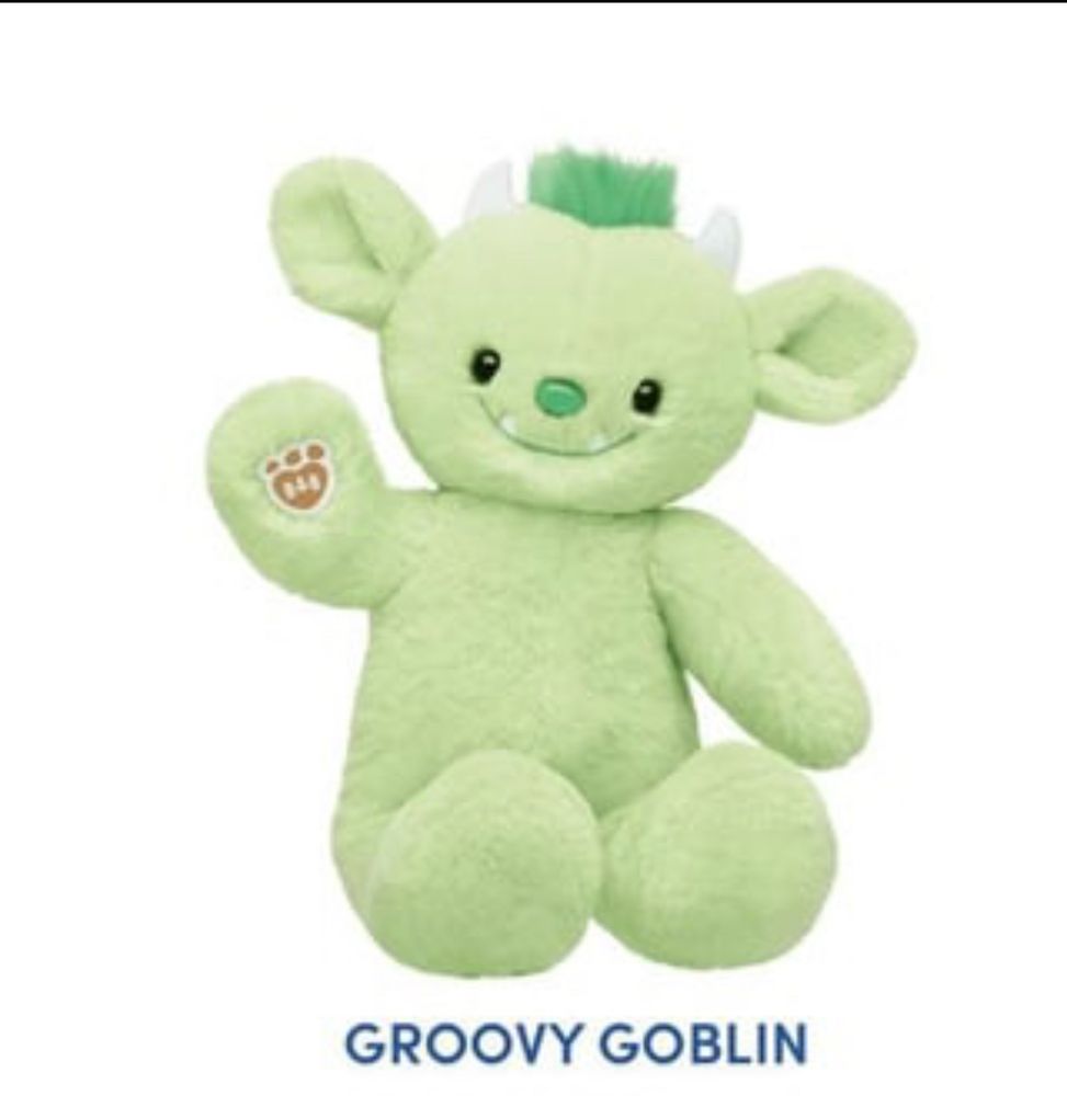 groovy goblin build a bear, a light green goblin plushie with fangs and horns and a tuft of green hair. 