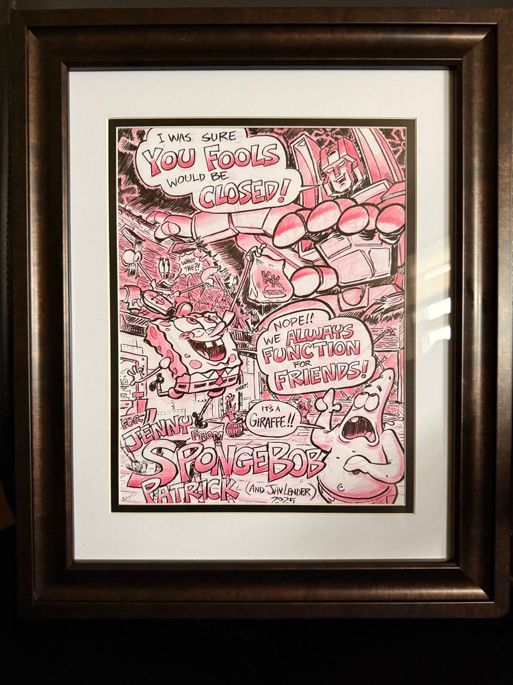 A drawing by Jay Lender of Spongebob, Patrick, and Mr Krabs freaking out/being excited by the fact that Starscream has ripped the roof off of the Krusty Krab. Starscream is saying “I was sure you fools would be closed!” Spongebob replies, “Nope!! We always function for friends!” Patrick exclaims “It’s a giraffe!!”