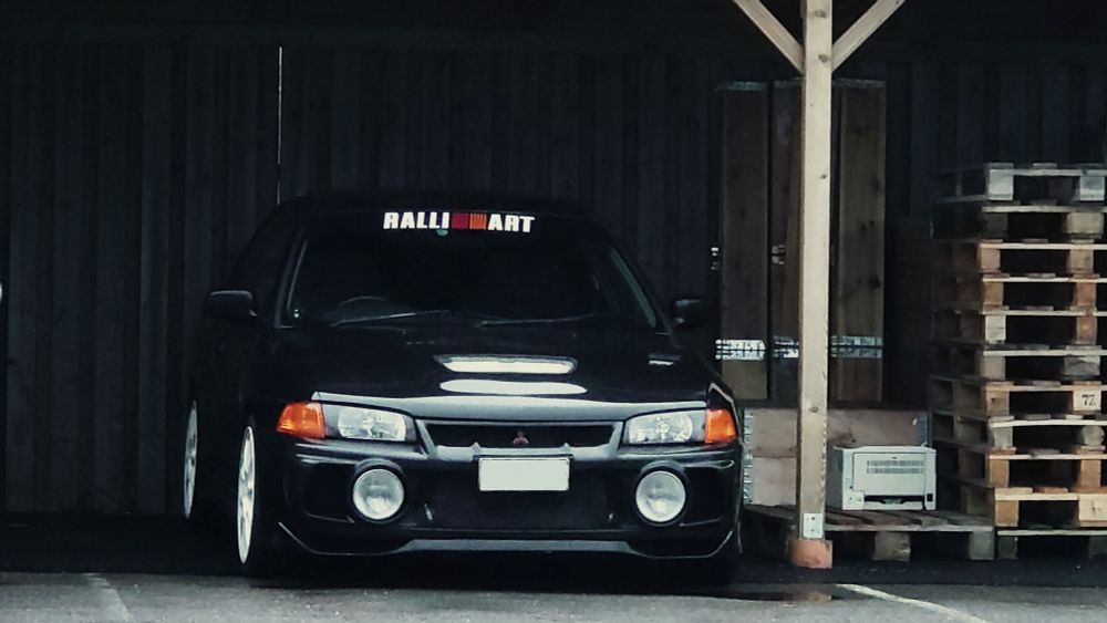 Lightly modified 1997 Mitsubishi Lancer Evolution IV GSR in black. 