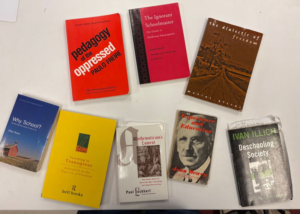 Photo of books - Jacques ranciere the ignorant schoolmaster, Maxine Greene the dialectic of freedom, Paulo friere pedagogy of the oppressed, Mike rose why school, bell hooks teaching to transgress, paul Lockhart a mathematicians lament, Dewey experience and education Ivan illicj deschooling society 