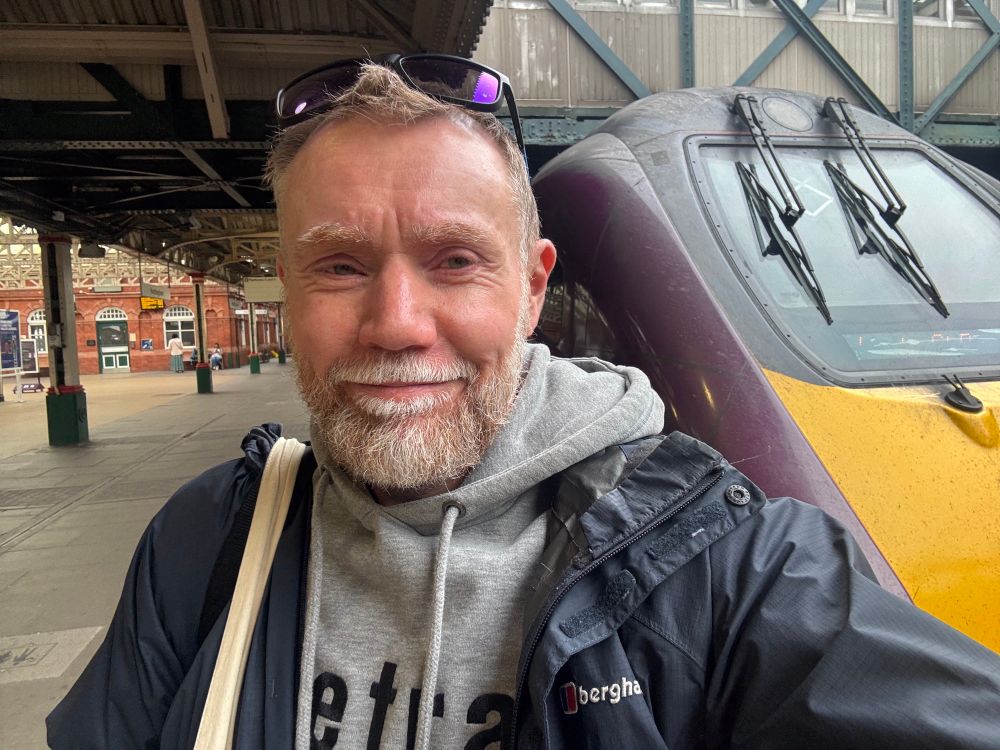Chris on a train platform 
