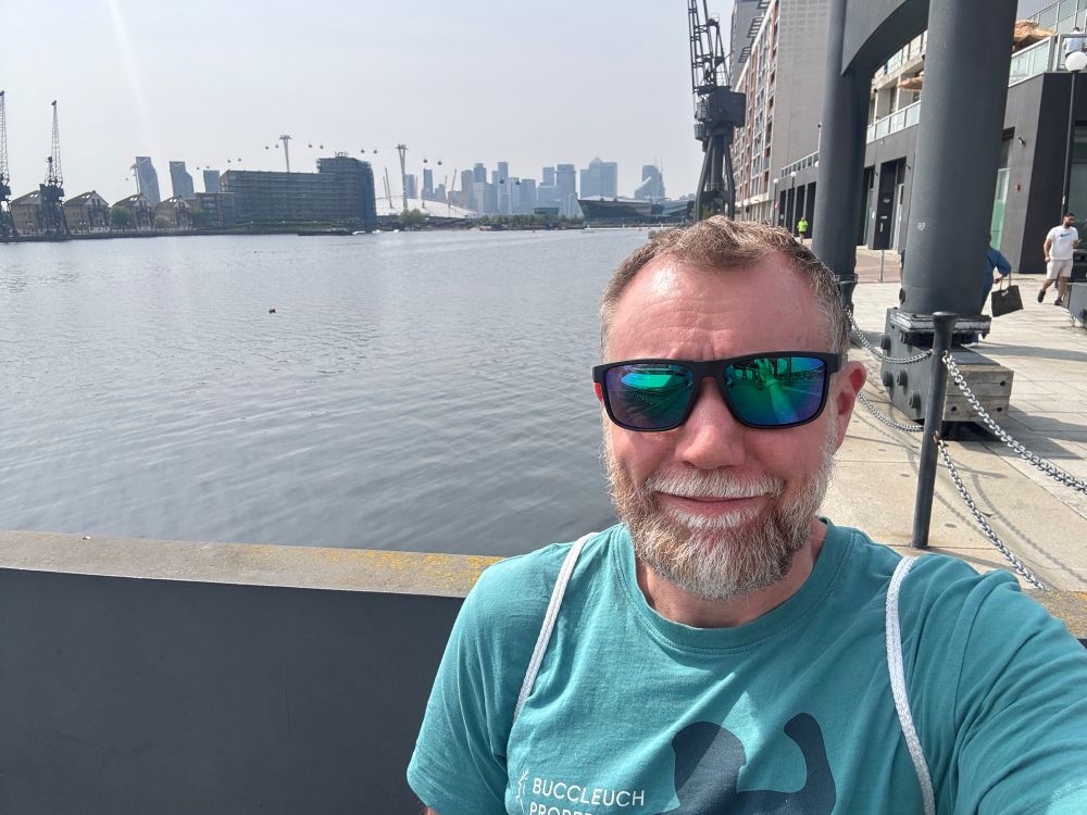 Chris on the water’s edge in Docklands