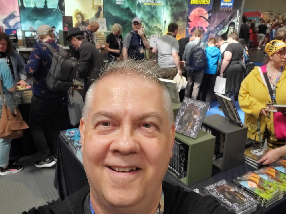 In front of the Chaosium stand. Mike Mason was there!