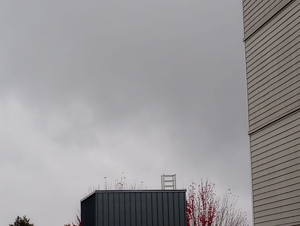A rain cloud rolling across the sky in Seattle.