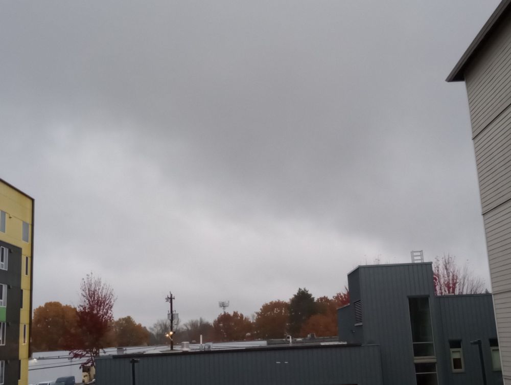 A rain cloud rolling across the sky in Seattle.