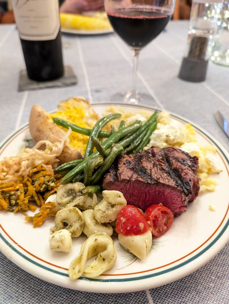 Filet mignon, baked potato, corn, green beans, carrot & chickpea spicy salad, pasta/cheese/tomato.