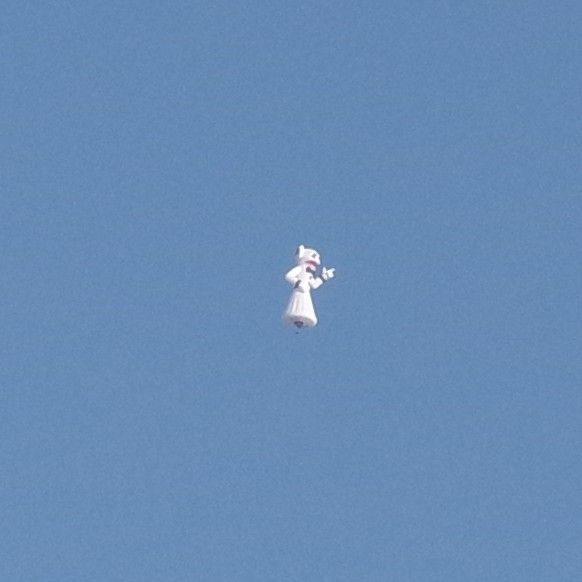 Ghost cat inflatable floating in the sky.