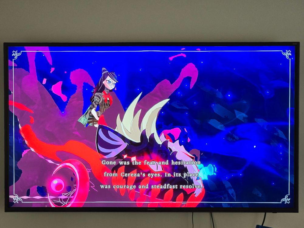 Young Cereza is sitting atop a giant demon defiantly.