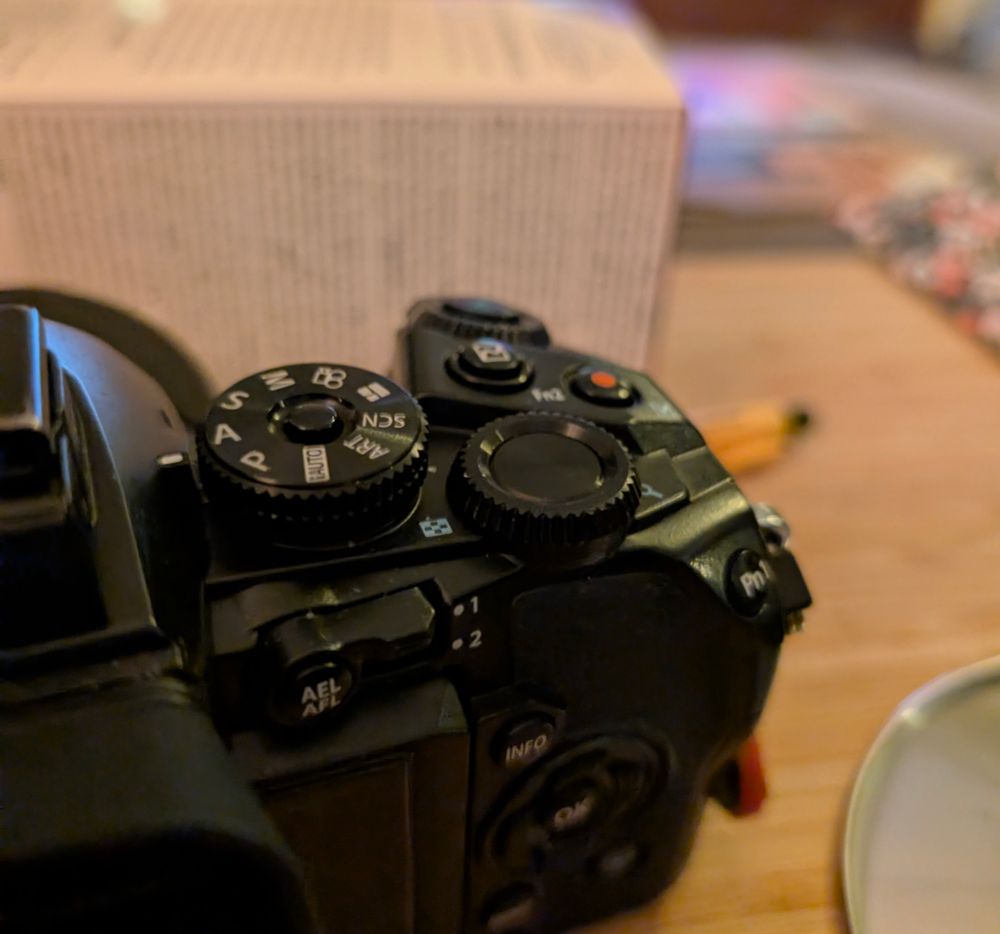 View of the back of an Olympus OM-D E-M1. It's troublesome rear control dial in the middle of the frame.