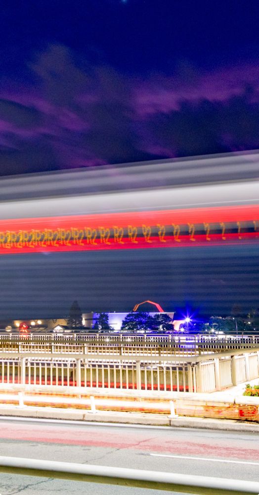 Photo of the National museum with a bus going past in the foreground. You can see the way the light stamps the letter R and the number 2 onto the sensor as it flickers while the bus travels at approximately 60km/h 