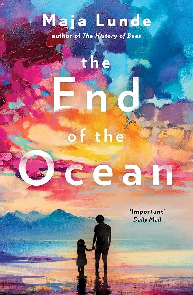 Book cover The End of the Ocean by Maja Lund. Silhouette of a man and girl with mountains in the background and beautiful pin, blue and yellow sky