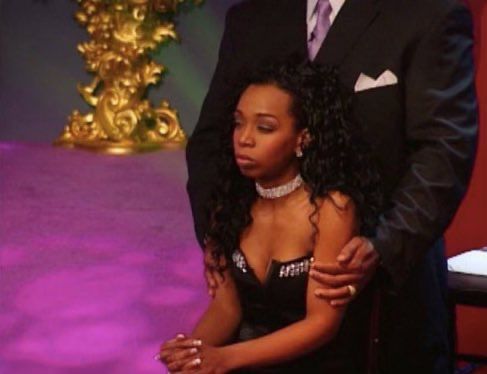 New York on stage at the Flavor of Love reunion, sitting and clasping her hands to muster her patience as Flav’s bodyguard gently holds her shoulders so she doesn’t jump anyone. 