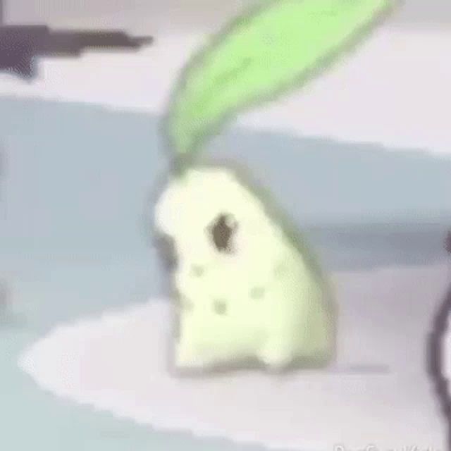 a cartoon character with a green leaf on its head is standing on a white surface .