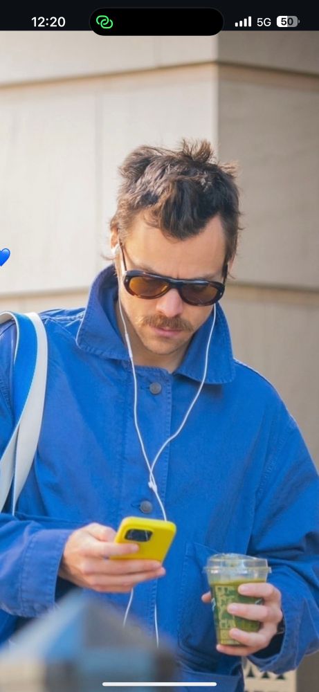 harry styles in sunglasses and blue jacket