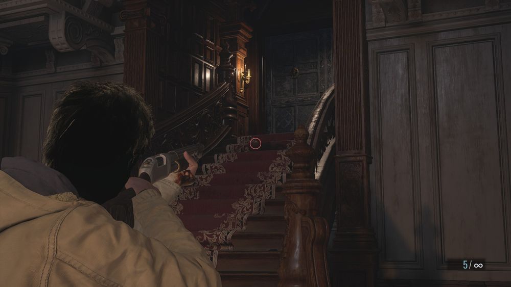 RE8 screenshot inside the castle. Ethan is holding and aiming a shotgun. but his face/hair has been covered in darkness to hide his identity