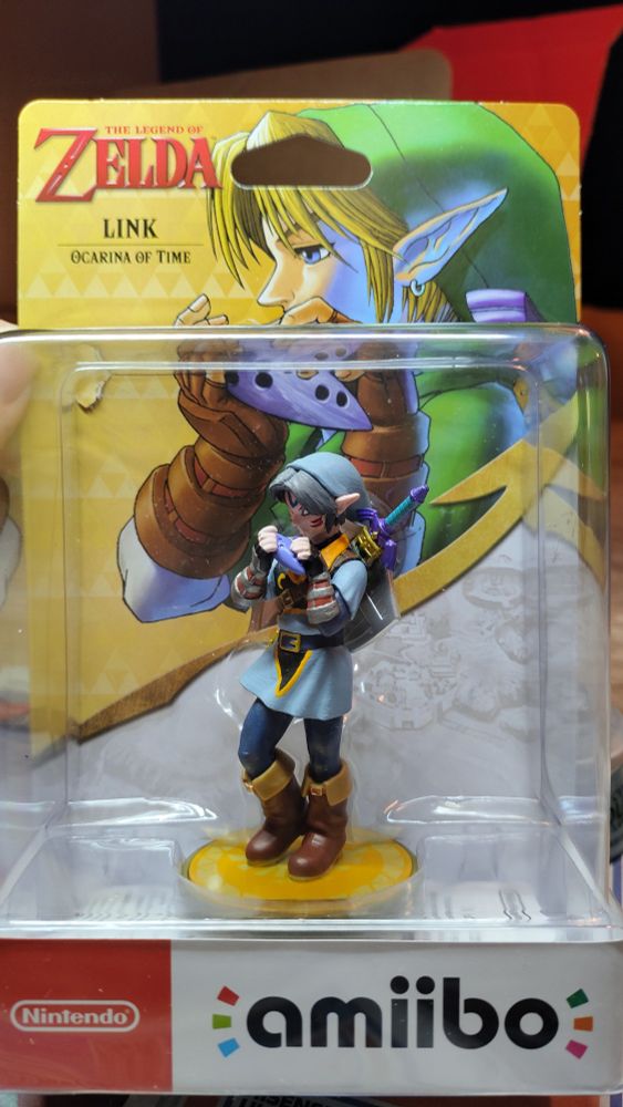 Picture of a custom painted OoT Link amiibo in the box. Link is painted like the fierce deity.