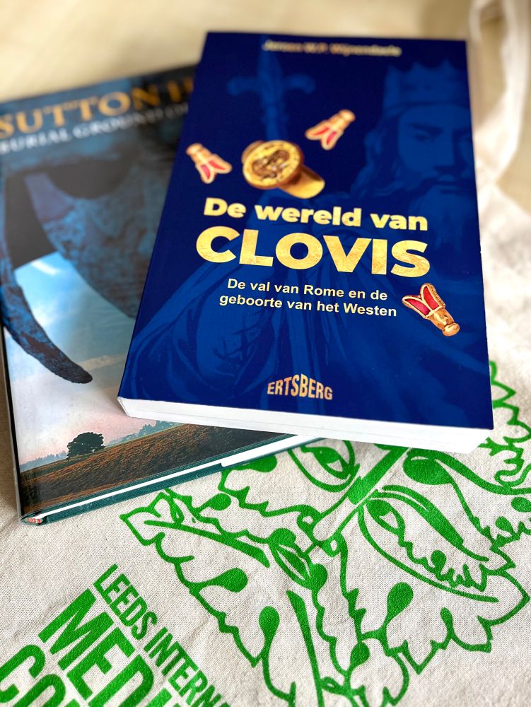 Two books and a tote bag from IMC Leeds 2025. 