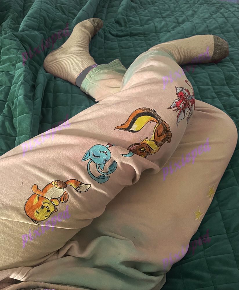 neopets sweatpants and white socks cozy on a blanket