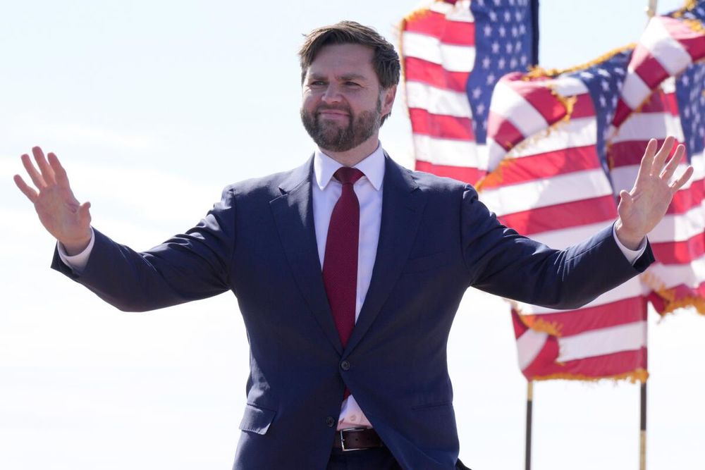 Photo of JD Vance with American flags.