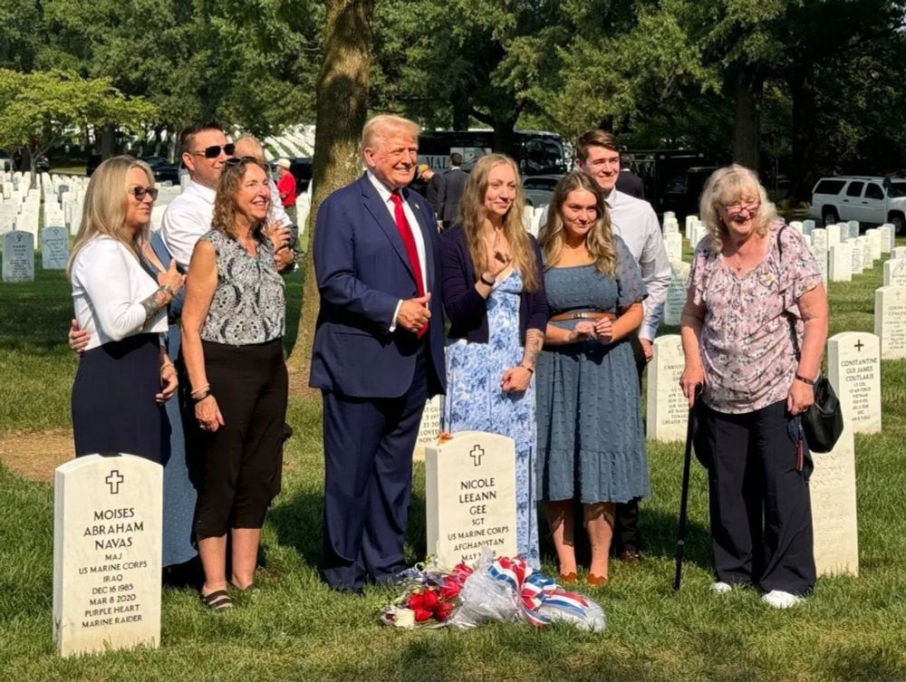 Trump giving a thumbs-up at an illegal campaign event at Arlington National Cemetery.