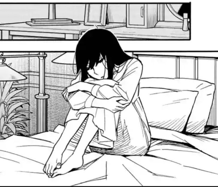 Yor Briar from Spy x family sitting on her bed, she looks sad.