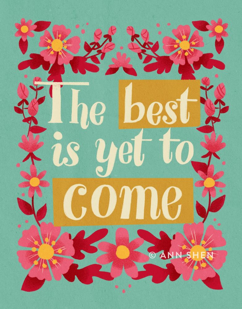 Hand lettered “the best is yet to come” on sea foam green background with pink and red floral frame.