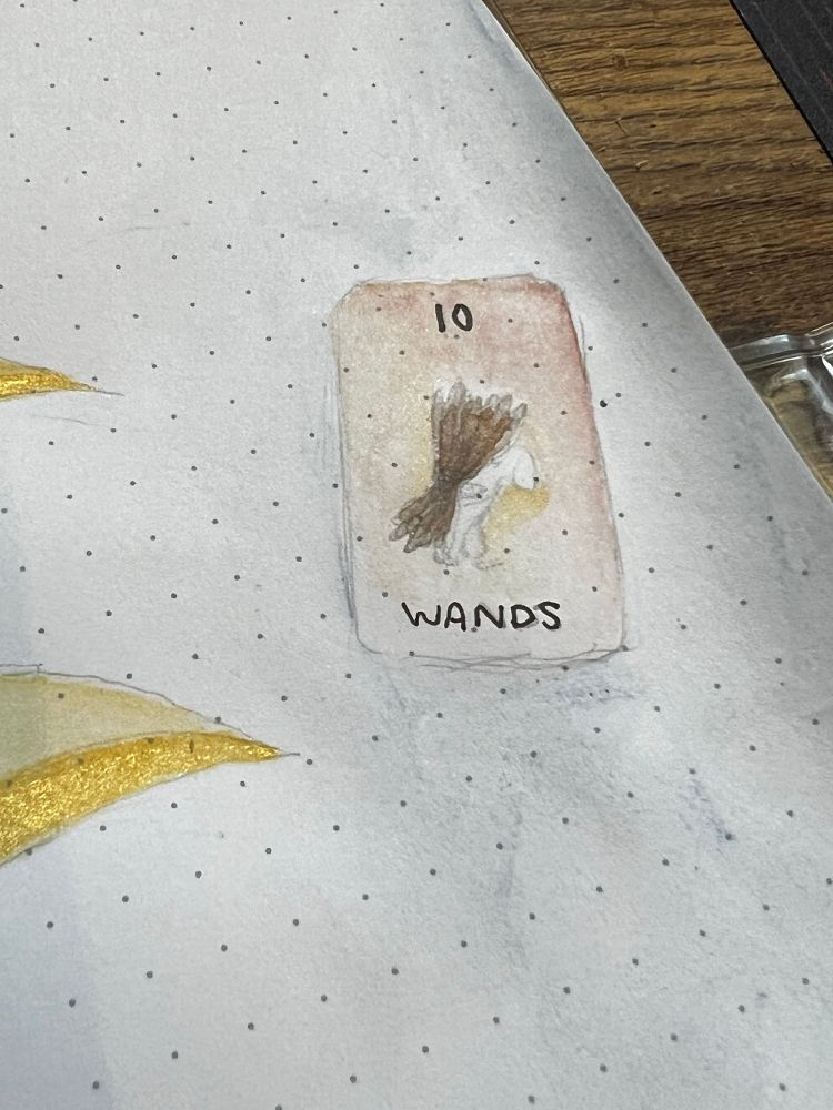 A painting of a ten of wands tarot card