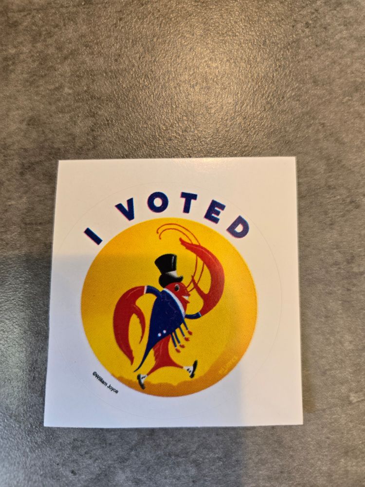 And "I Voted" sticker featuring a crawfish in tails and tophat celebrating Louisiana voters